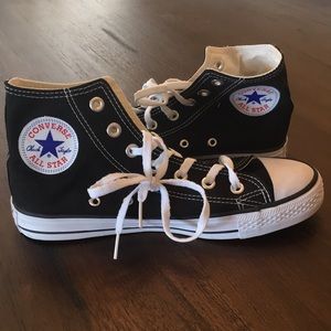 High top black converse sneakers.
